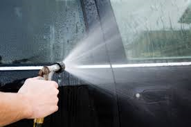 spraying hose on car